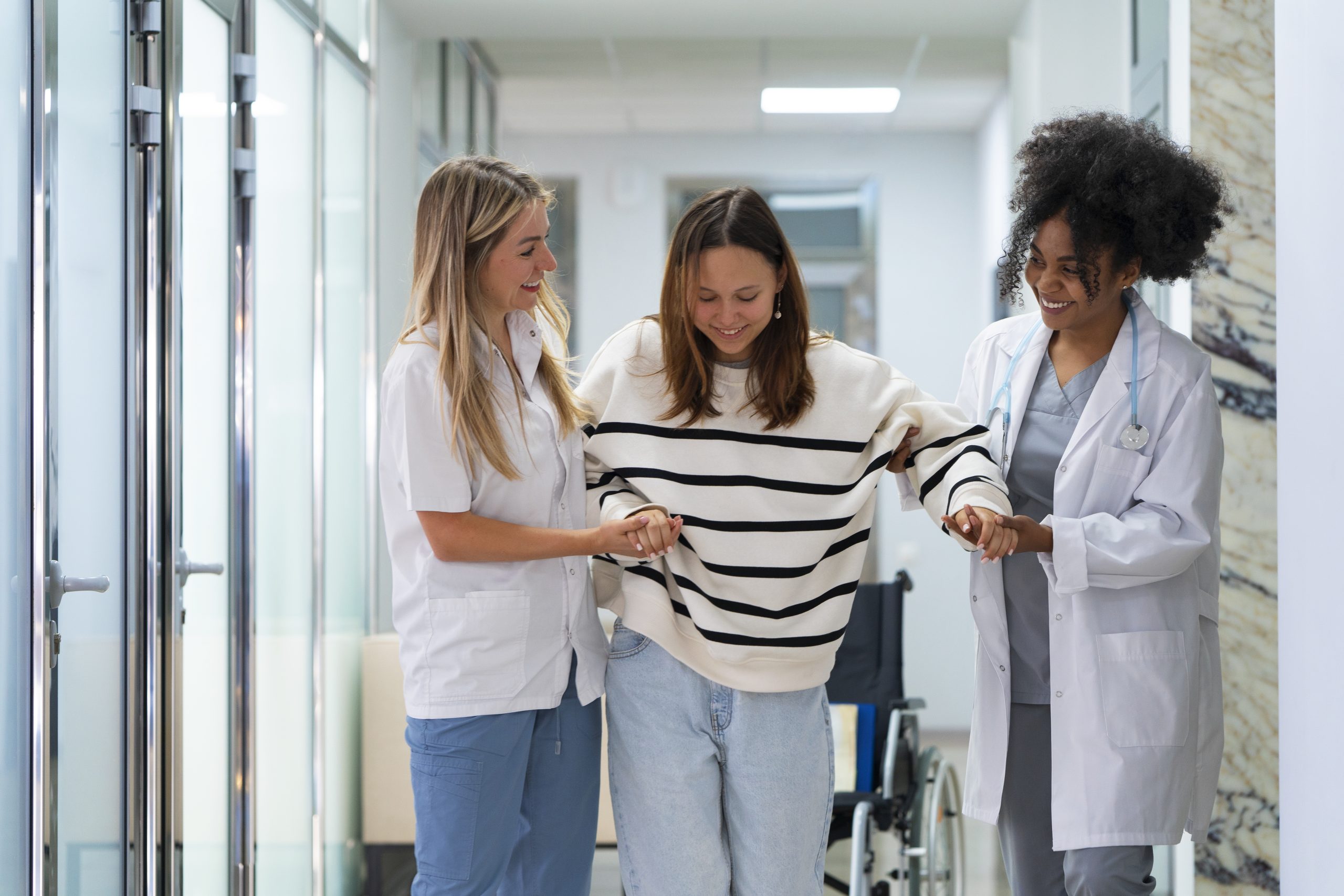 front-view-female-doctors-helping-patient